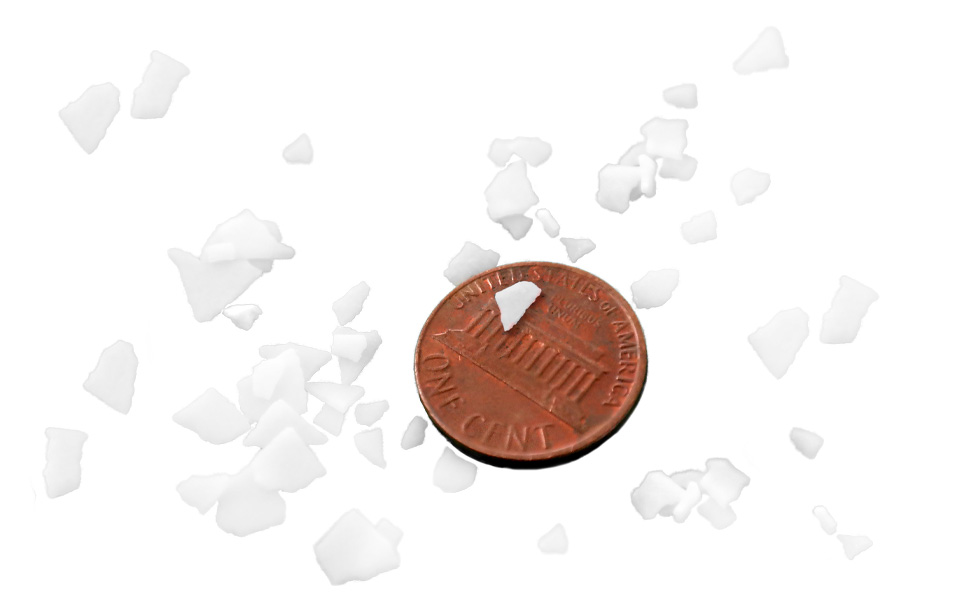 Potassium Hydroxide Flakes KOH Potash image reflecting size and color by penny